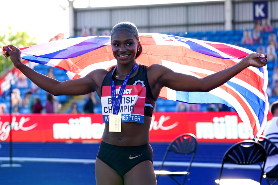 Dina Asher-Smith celebrates after winning the women’s 100-meter final during day two of the Muller British Athletics Championships at Manchester Regional Arena. - Credit: Martin Rickett/AP