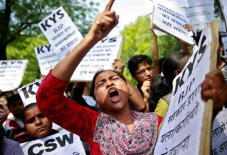 A woman reacts at a protest against the rape of an eight-year-old girl, in Kathua, near Jammu and a teenager in Unnao, Uttar Pradesh state, in New Delhi, India April 12, 2018. REUTERS/Cathal McNaughton