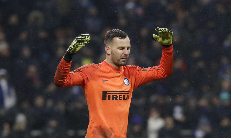 Inter Milan goalkeeper Samir Handanovic reacts after saving on a penalty during a shootout in an Italian Cup quarterfinal soccer match between Inter Milan and Lazio at the San Siro stadium, in Milan, Italy, Thursday, Jan. 31, 2019. (AP Photo/Luca Bruno)