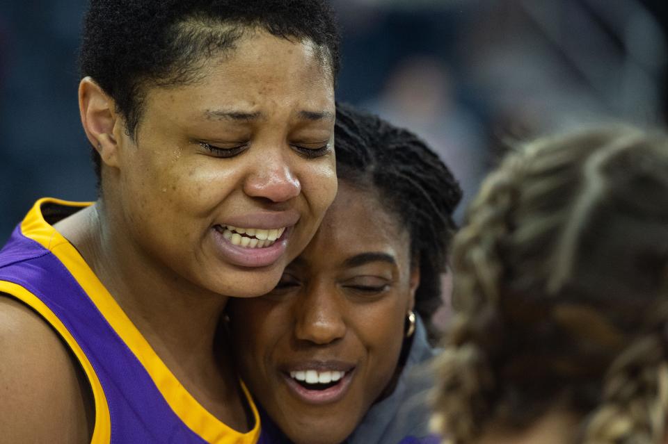 Tennessee Tech’s DJ McFarlane (35) hugs Tennessee Tech’s Maaliya Owens (11) moments after winning the OVC women's championship at Ford Center on Saturday, March 4, 2023.
