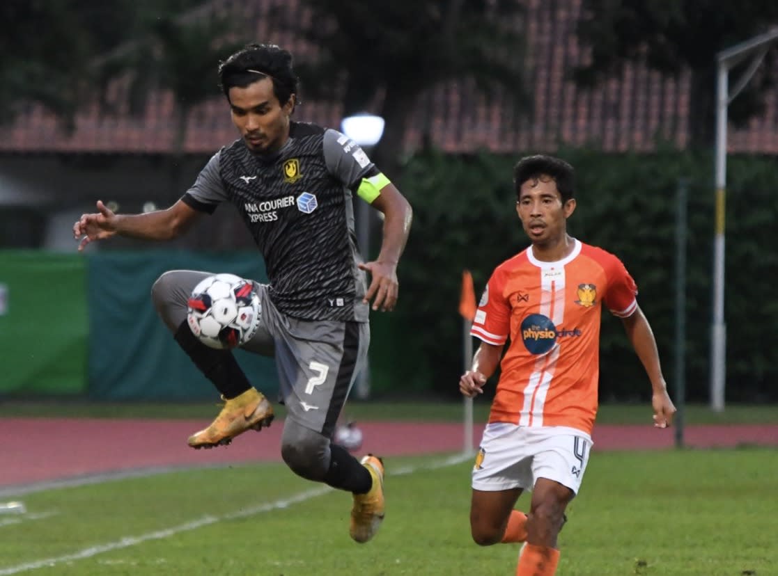 Tampines Rovers' Yasir Hanapi (left) battles for the ball with Hougang United's Nazrul Nazari in their Singapore Premier League match (PHOTO: SPL)