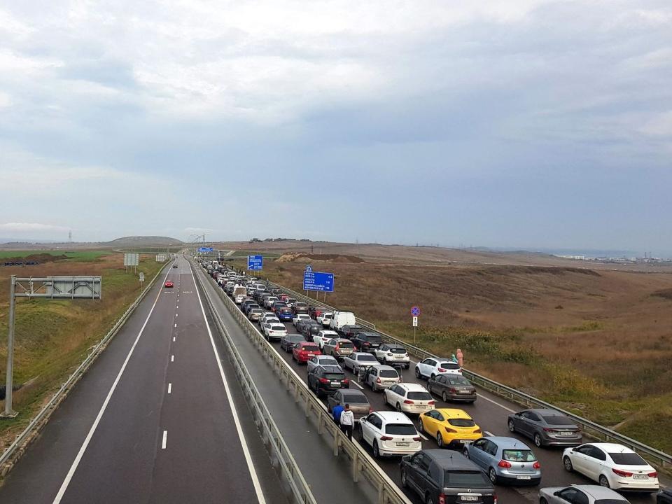 Vehicles wait to cross Russian Crimea bridge near Kerch