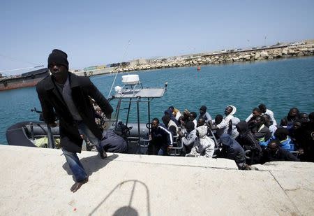 An illegal migrant steps out the navy boat after he was brought back to the coastal city of Tripoli May 5, 2015. REUTERS/Ismail Zitouny