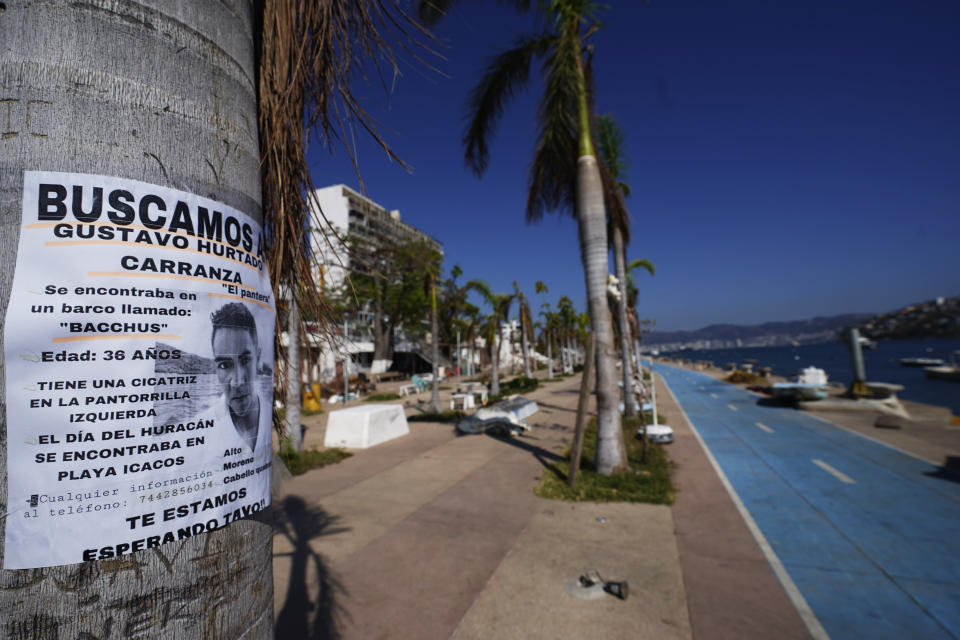 A missing persons sign hangs on a tree in Acapulco, Mexico, Sunday, Nov. 12, 2023. It was 12:20 a.m. on Oct. 25. when Hurricane Otis made landfall in this Pacific port city as a Category 5 hurricane, leaving 48 dead, mostly by drowning, and 31 missing, according to official figures. Sailors, fishermen and relatives of crew members believe that there may be more missing because sailors often go to take care of their yachts when a storm approaches. (AP Photo/Marco Ugarte)