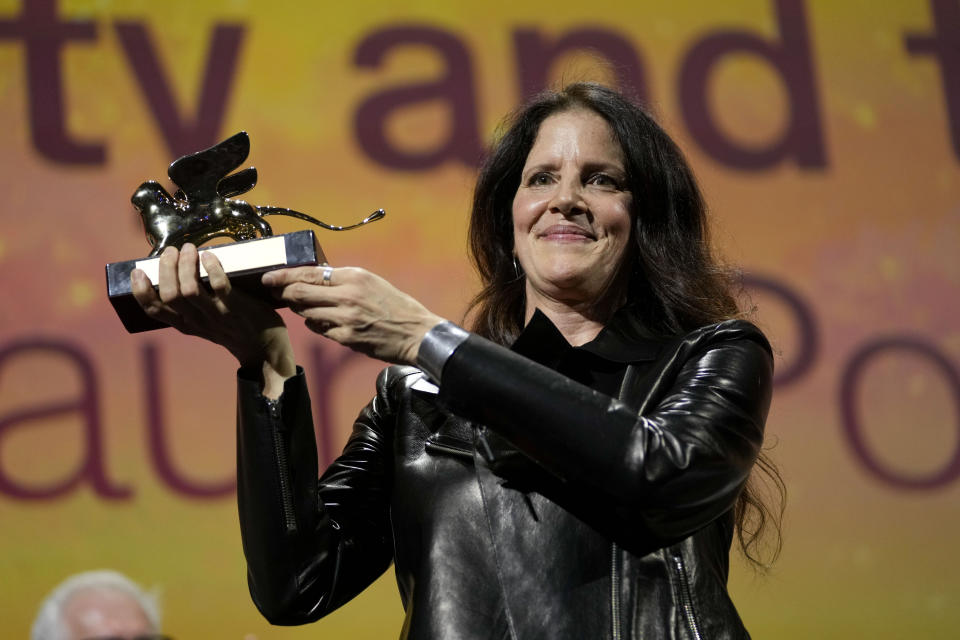 Director Laura Poitras holds the Golden Lion award for best film for 'All the Beauty and the Bloodshed' at the closing ceremony of the 79th edition of the Venice Film Festival in Venice, Italy, Saturday, Sept. 10, 2022. (AP Photo/Domenico Stinellis)