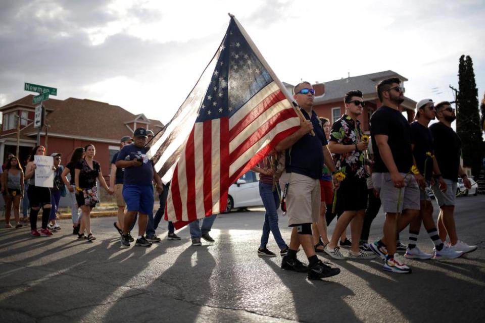 People take part in a rally against hate a day after a mass shooting at a Walmart store, in El Paso, Texas.