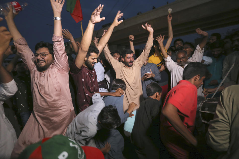 Supporters of Pakistan's former Prime Minister Imran Khan celebrate after Supreme Court decision, in Multan, Pakistan, Thursday, May 11, 2023. Pakistan's Supreme Court on Thursday ordered the release of Khan, whose arrest earlier this week sparked a wave of violence across the country by his supporters. (AP Photo/Asim Tanveer)