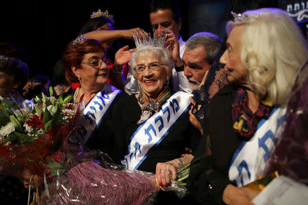 Holocaust survivor Tova Ringer, 93, reacts after winning the annual Holocaust survivors' beauty pageant in Haifa, Israel October 14, 2018. REUTERS/Corinna Kern