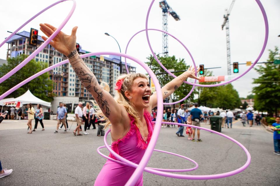 Chloe Wall preforms one of her hula hoop routines during Artisphere