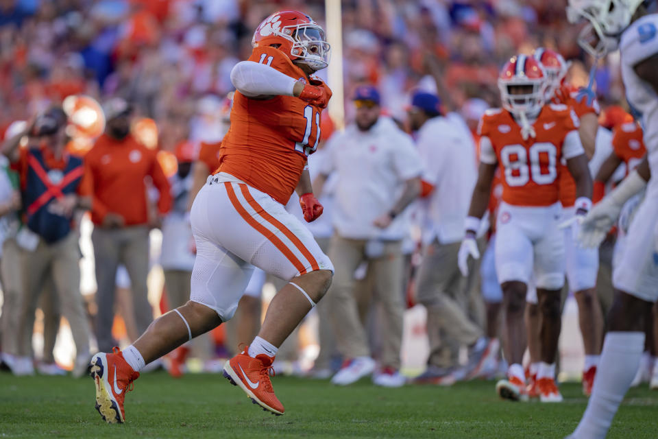 Clemson defensive tackle Peter Woods (11) reacts during the first half of an NCAA college football game against North Carolina, Saturday, Nov. 18, 2023, in Clemson, S.C. (AP Photo/Jacob Kupferman)