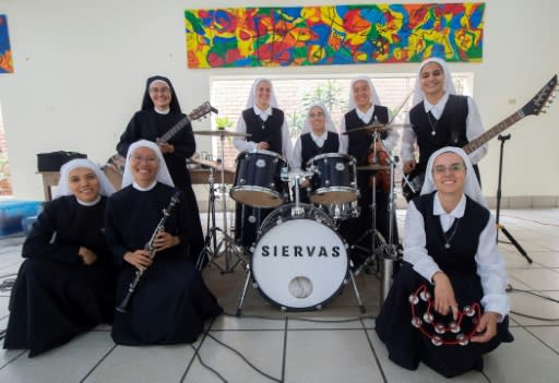 Known as "Siervas" or Servants, a band made up of nuns plays catchy Christian songs that sound indistinguishable from many of their peers in mainstream rock