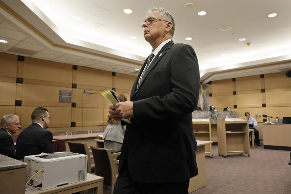 Former Marjory Stoneman Douglas High School School Resource Officer Scot Peterson leaves the courtroom following a hearing in his case at the Broward County Courthouse in Fort Lauderdale, Fla., Monday, May 22, 2022. Broward County prosecutors charged Peterson, a former Broward Sheriff's Office deputy, with criminal charges for failing to enter the 1200 Building at the school and confront the shooter, Nikolas Cruz, during a mass shooting at the Parkland high school five years ago. (Amy Beth Bennett/South Florida Sun-Sentinel via AP, Pool)