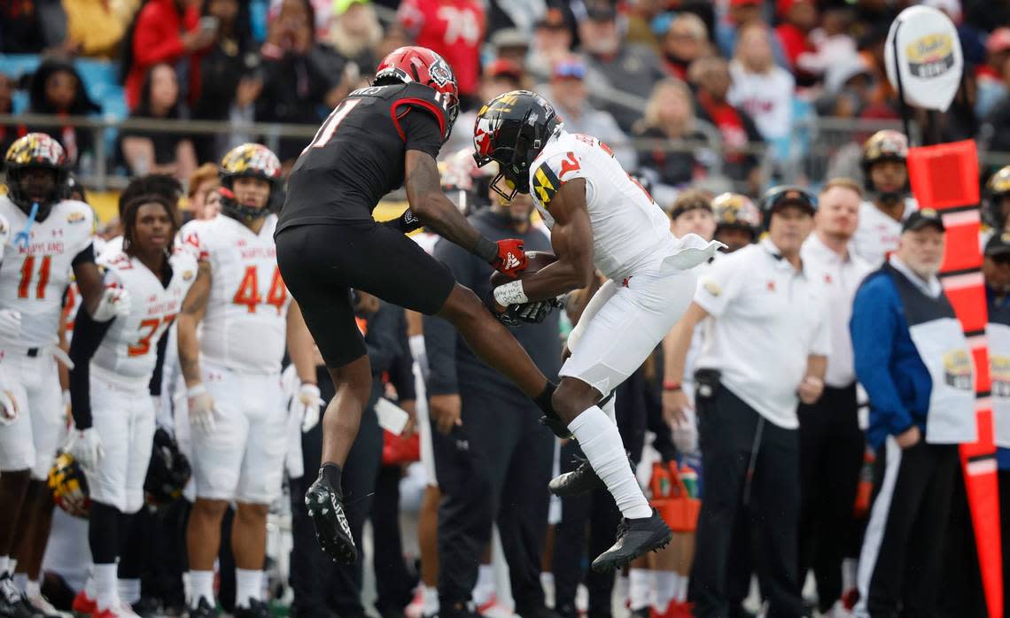 Maryland defensive back Jakorian Bennett (2) intercepts the ball intended for N.C. State wide receiver Darryl Jones (11) during the second half of Maryland’s 16-12 victory over N.C. State in the Duke’s Mayo Bowl at Bank of America Stadium in Charlotte, N.C., Friday, Dec. 30, 2022.