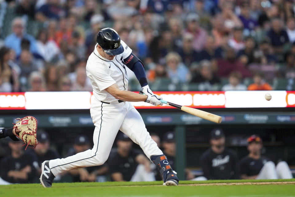 Detroit Tigers' Mark Canha hits into a fielders choice against the Cleveland Guardians the eighth inning of a baseball game, Monday, July 8, 2024, in Detroit. Jake Rogers scored on a shortstop Brayan Rocchio error on the play. (AP Photo/Paul Sancya)