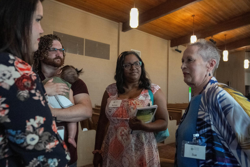 Emily and her husband Mike talk to Melissa Snyder and Sue Whitesel Sunday, June 25, 2023, at Carmel Friends Church after the Quaker service in Carmel.