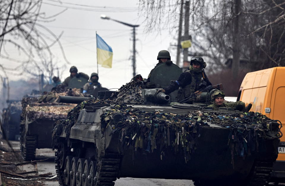 Ukrainian soldiers are pictured in their tanks, amid Russia's invasion on Ukraine, in Bucha, in Kyiv region, Ukraine April 2, 2022. REUTERS/Zohra Bensemra