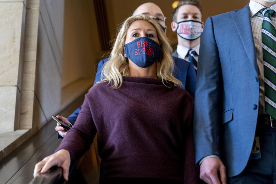 Rep. Marjorie Taylor Greene, R-Ga., goes back to her office after speaking on the floor of the House Chamber on Capitol Hill in Washington, Thursday, Feb. 4, 2021. (AP Photo/Andrew Harnik)