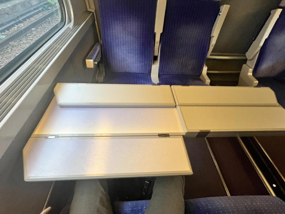 A folding table on a TGV Lyria