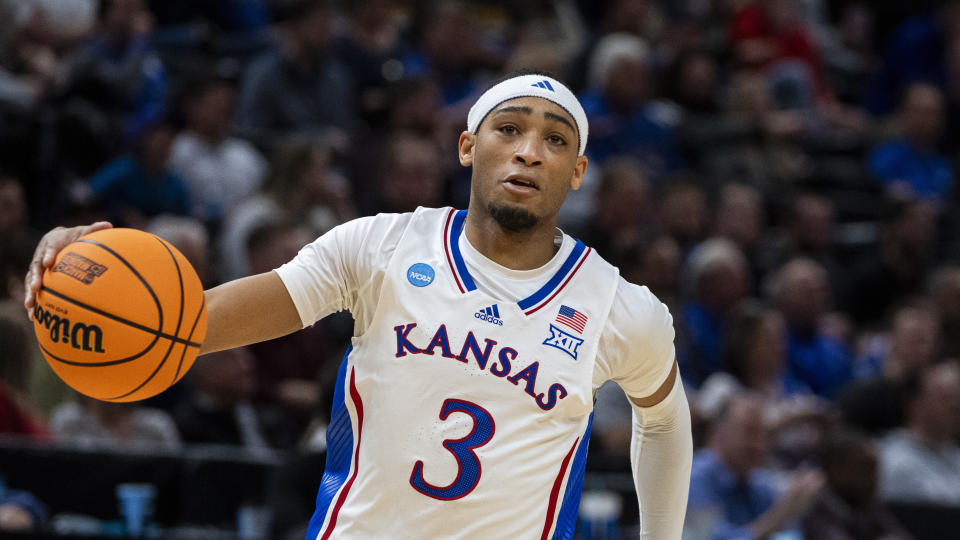 Kansas guard Dajuan Harris Jr. (3) brings the ball upcourt against Samford during the second half of a first-round college basketball game in the NCAA Tournament in Salt Lake City, Thursday, March 21, 2024. (AP Photo/Isaac Hale)