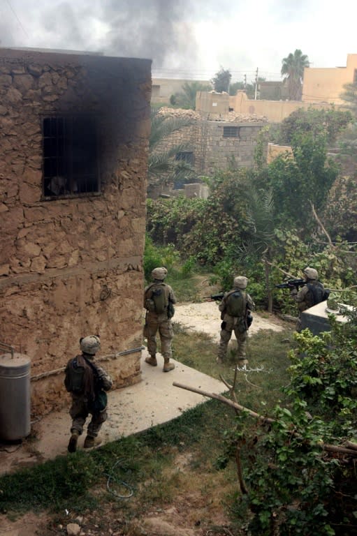 US marines carry out searches in the Iraqi insurgent bastion of Al-Qaim during Operation Steel Curtain on 15 November, 2005