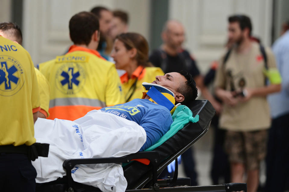 <p>An injured passenger is taken away on a stretcher from a train station in Barcelona, Spain, Friday, July 28, 2017. (Photo: Adrian Quiroga/AP) </p>