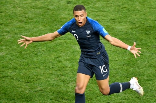 Golden boy: Kylian Mbappe celebrates his fourth goal of the tournament