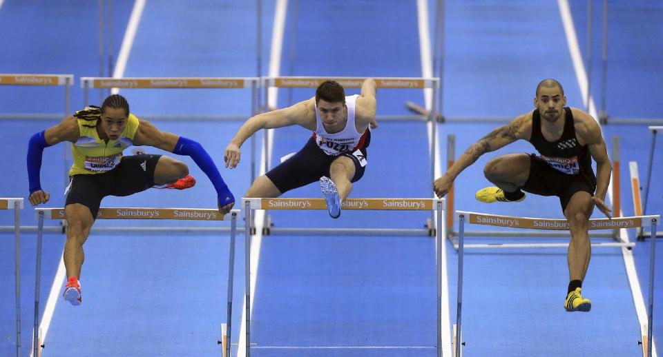 The 60-metre Hurdles Final with, from left, France's Pascal Martinot-Lagarde, Great Britain's Andrew Pozzi, France's Garfield Darien, during the British Athletics Indoor Grand Prix at the National Indoor Arena, Birmingham. England, Saturday Feb. 15, 2014. Pascal Martinot-Lagarde placed first, Pozzi second and Darien third. (AP Photo / Nick Potts, PA) UNITED KINGDOM OUT - NO SALES - NO ARCHIVES