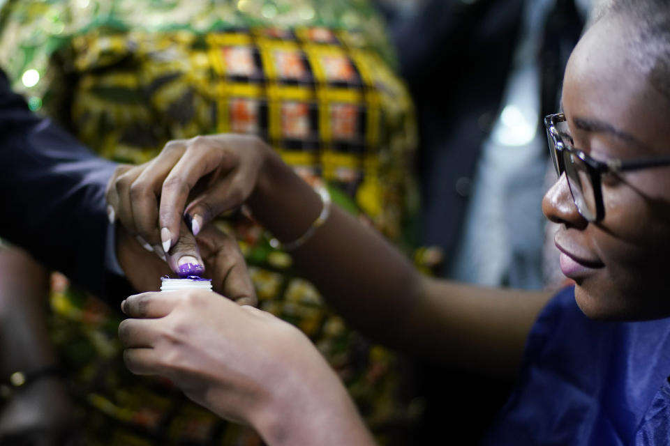 Congolese President Joseph Kabila gets his finger inked after casting his vote Sunday, Dec. 30, 2018 in Kinshasa, Congo. Forty million voters are registered for a presidential race plagued by years of delay and persistent rumors of lack of preparation. (AP Photo/Jerome Delay)