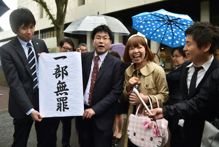 Japanese artist Megumi Igarashi (2nd R) and her lawyers speak to reporters in front of the Tokyo District Court, on May 9, 2016