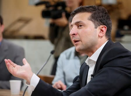 Ukraine's President Volodymyr Zelenskiy holds a press-marathon at a food market in Kiev