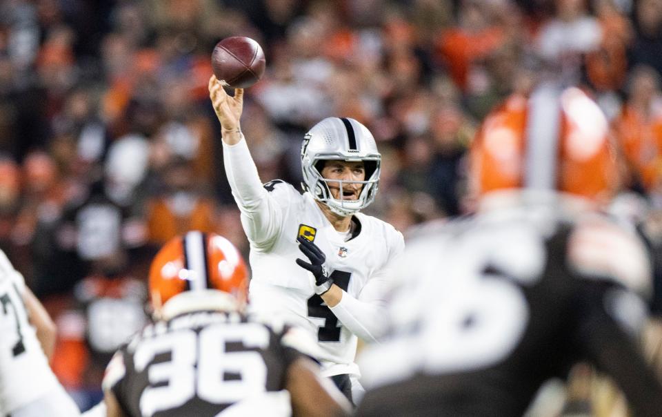 Dec 20, 2021; Cleveland, Ohio, USA; Las Vegas Raiders quarterback Derek Carr (4) throws the ball against the Cleveland Browns during the first quarter at FirstEnergy Stadium. Mandatory Credit: Scott Galvin-USA TODAY Sports