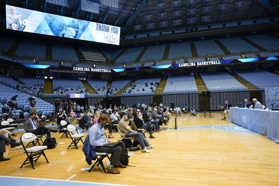 North Carolina Head Basketball Coach Roy Williams, right, speaks with members of the media during a news conference, Thursday, April 1, 2021, in Chapel Hill, N.C. Williams is retiring after 33 seasons and 903 wins as a college basketball head coach. The Hall of Fame coach led the University of North Carolina to three NCAA championships in 18 seasons as head coach of the Tar Heels. (AP Photo/Gerry Broome)