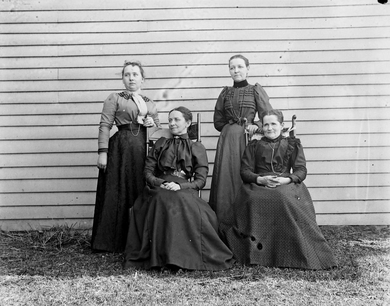 The Munroe Falls Mush Club was devoted to wild mushroom foraging and mushroom farming classes. The Munroe Falls Historical Society identifies the standing women as Mrs. Sam Harris and Mrs. J.J. Uplinger and the seated women as Mrs. McCracken and Mrs. Stromare.