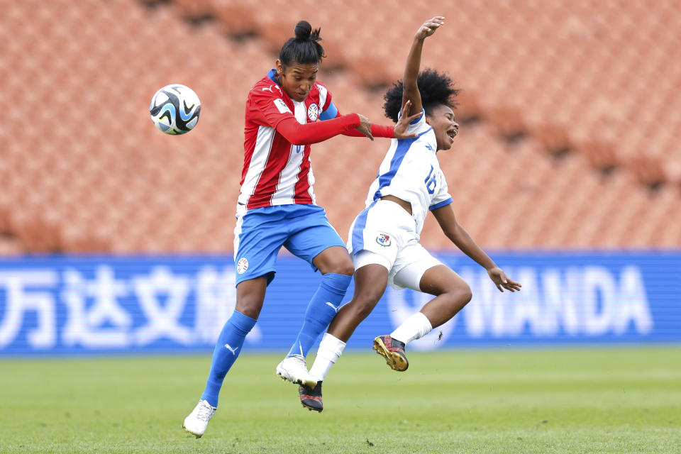 Veronica Riveros, left, of Paraguay and Rebeca Espinosa of Panama battle for the ball during their FIFA women's World Cup qualifier in Hamilton, New Zealand, Thursday, Feb. 23, 2023. (Martin Hunter/Photosport via AP)