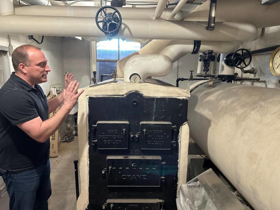 Dan Everhart, Idaho State Historic Preservation Office outreach historian, explains the old coal-fired boiler system installed in the basement of the Assay Office in Boise by the U.S. Forest Service when it took over the building in 1932. The building is now connected to the city’s geothermal system, but the boiler remains. Scott McIntosh/smcintosh@idahostatesman.com