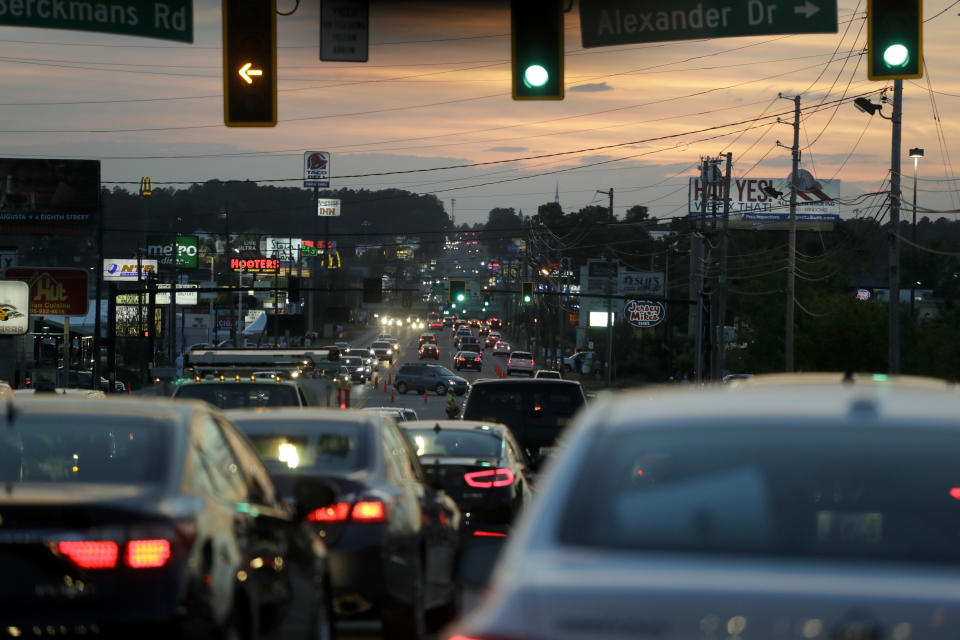 FILE - In this April 12, 2019, file photo, traffic is shown along Washington Road after the second round for the Masters golf tournament in Augusta, Ga. Augusta was supposed to host the golf's first major championship this week. But the Masters has been put off until at least November, dealing the Georgia city a huge financial blow. (AP Photo/Chris Carlson, File)