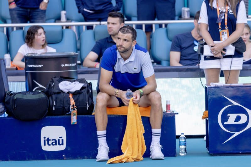 Grigor Dimitrov from Bulgaria sits with a dejected look after losing to Jinnik Sinner from Italy in the Miami Open men's final Sunday at Hard Rock Stadium in Miami Gardens, Fla. File Photo by Gary I Rothstein/UPI