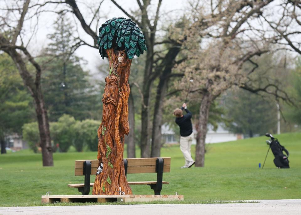 A tree sculpture displays during Arbor Day at Homewood Golf course on Friday, April 26, 2024, in Ames, Iowa.