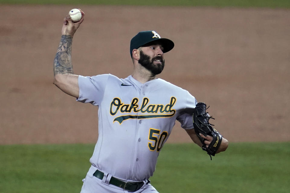 Oakland Athletics starting pitcher Mike Fiers throws to a Los Angeles Dodgers batter during the first inning of a baseball game Thursday, Sept. 24, 2020, in Los Angeles. (AP Photo/Marcio Jose Sanchez)