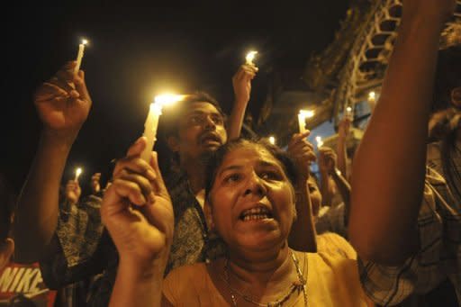 Myanmar demonstrators hold a candlelight protest at Sule pagoda against severe power cuts in Yangon. Protests against chronic power shortages in Myanmar spread to Yangon late Tuesday following rallies in the second city of Mandalay that saw several opposition party members briefly held by police