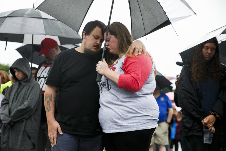 Anthony Moore and Kaitlyn Mitchell, of Virginia Beach, Va., embrace during a vigil for the victims of the mass shooting June 1, 2019 in Virginia Beach, Va. DeWayne Craddock, a longtime city employee, opened fire at the municipal building Friday before police shot and killed him, authorities said. (Photo: Kristen Zeis/The Virginian-Pilot via AP)