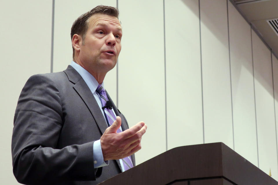 Former Kansas Secretary of State Kris Kobach, a Republican candidate for the U.S. Senate, makes a point during a debate at a statewide GOP convention, Saturday, Feb. 1, 2020, in Olathe, Kan. Kobach is trying overcome doubts about his electability after losing the 2018 governor's race and is touting his ties to President Donald Trump as the first prominent Kansas politician to endorse Trump in 2016. (AP Photo/John Hanna)
