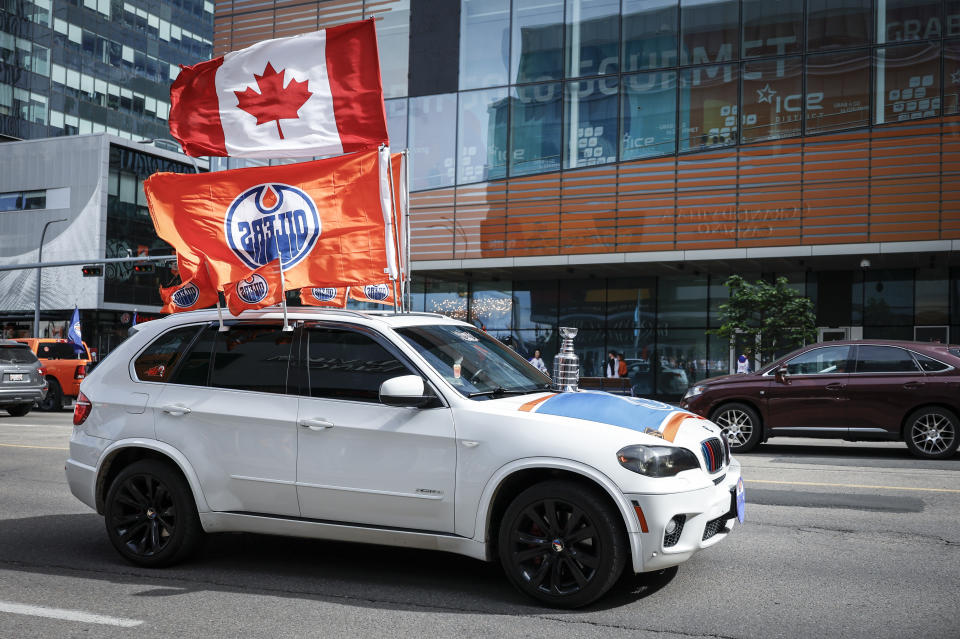 Edmonton Oilers fans arrive for Game 4 of the NHL hockey Stanley Cup Final between the Oilers and the Florida Panthers, Saturday, June 15, 2024, in Edmonton, Alberta. (Jeff McIntosh/The Canadian Press via AP)