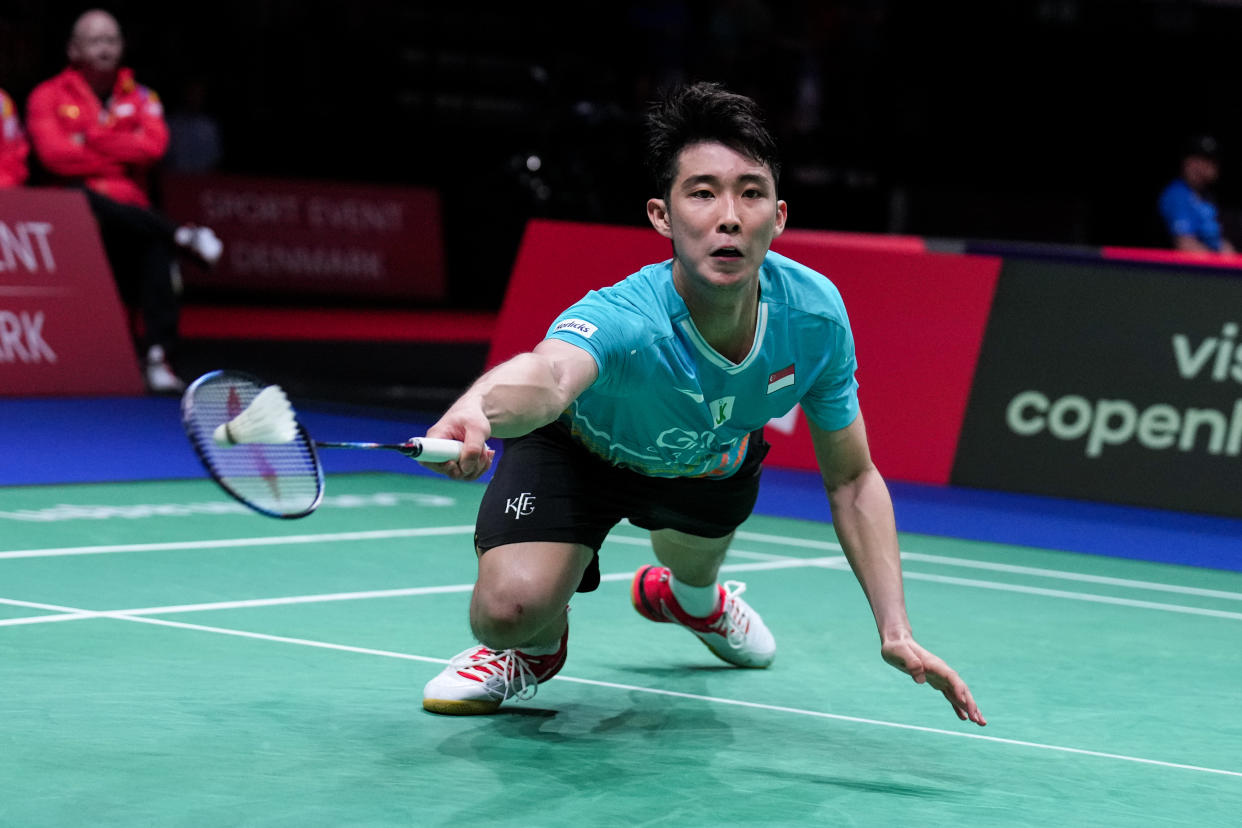 Singapore's Loh Kean Yew retrieves a shot against India's H.S. Prannoy at the 2023 BWF World Championships. 