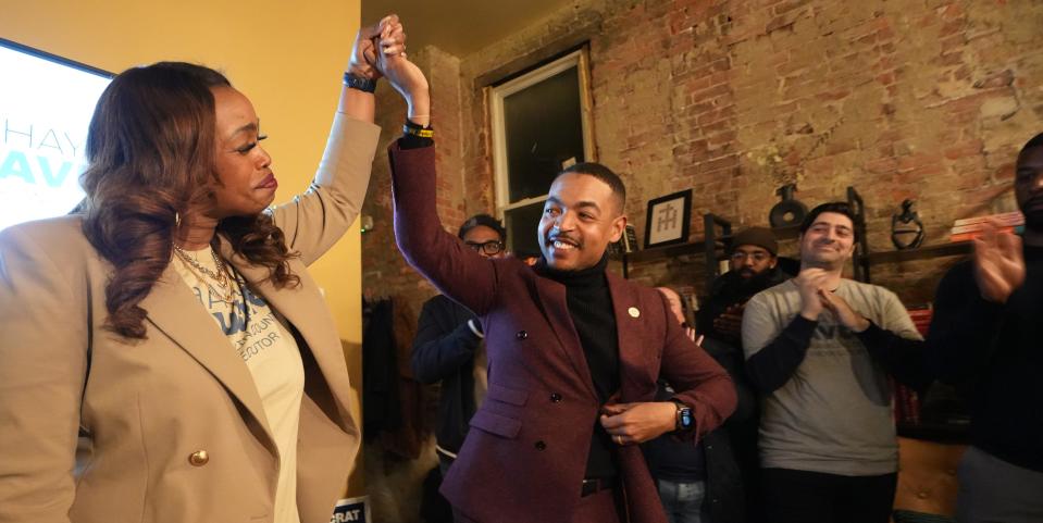 Shayla Favor raises hands with City Council President Shannon Hardin after she talked about her winning primary race for Franklin County Prosecutor at her watch party held at Ground X Grind, 1106-1108 E Main St.