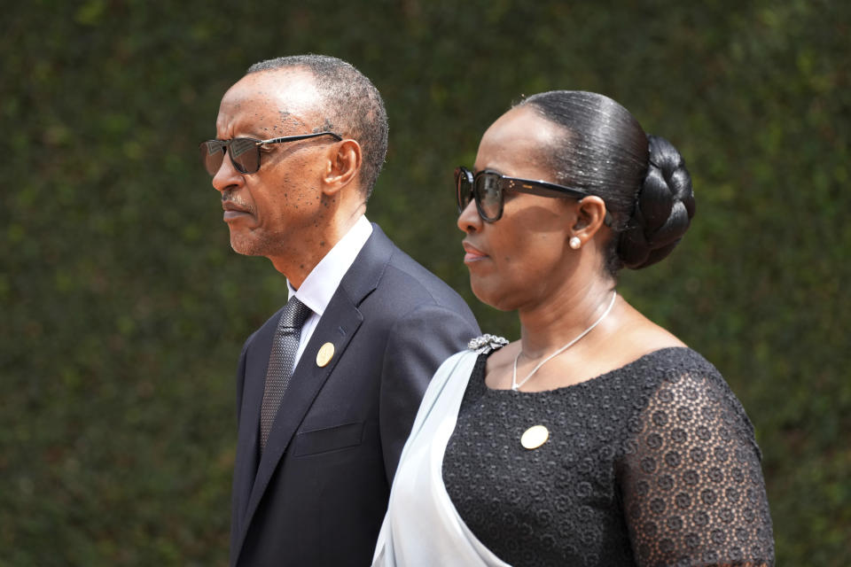 Rwandan President Paul Kagame, left, and his wife, first lady Jeannette Kagame arrive for a ceremony to mark the 30th anniversary of the Rwandan genocide, held at the Kigali Genocide Memorial, in Kigali, Rwanda, Sunday, April 7, 2024. Rwandans are commemorating 30 years since the genocide in which an estimated 800,000 people were killed by government-backed extremists, shattering this small east African country that continues to grapple with the horrific legacy of the massacres. (AP Photo/Brian Inganga)