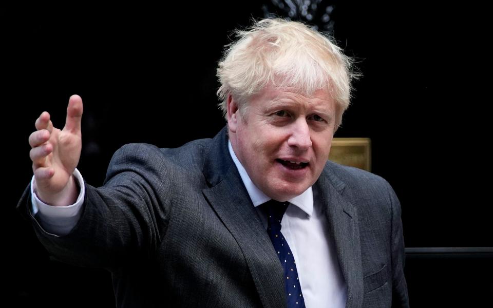 Britain's Prime Minister Boris Johnson gestures outside Number 10 Downing Street