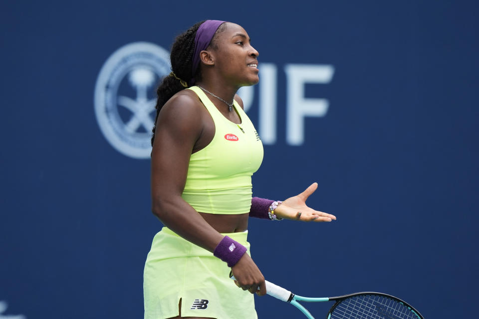 Coco Gauff reacts after losing a point to Caroline Garcia, of France, during the Miami Open tennis tournament, Monday, March 25, 2024, in Miami Gardens, Fla. (AP Photo/Wilfredo Lee)