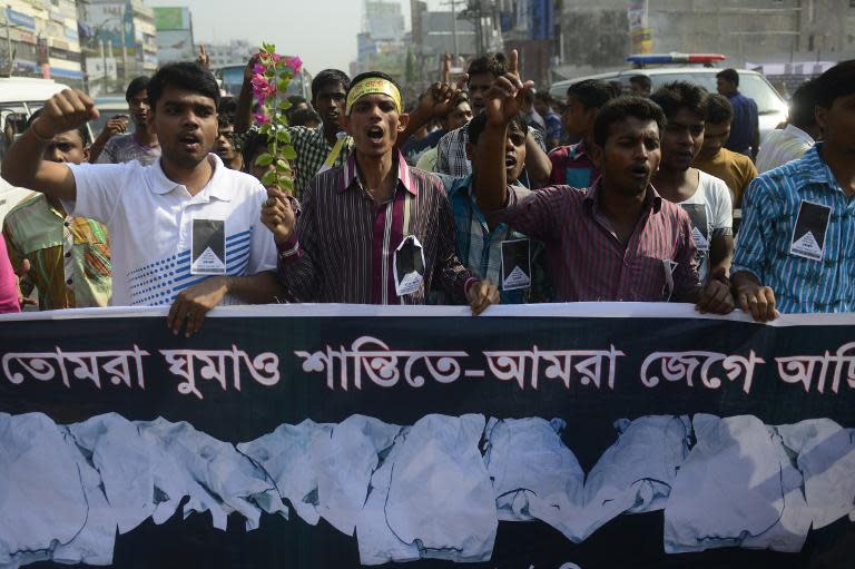 Bangladeshi garment workers take part in a protest marking the first anniversary of the Rana Plaza building collapse in Dhaka, on April 24, 2014