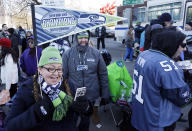 Seattle Seahawks fans wait for the team's Super Bowl championship parade to begin on Wednesday, Feb. 5, 2014, in Seattle. The Seahawks beat the Denver Broncos 43-8 in the NFL Super Bowl XLVIII football game on on Feb. 2, 2014. (AP Photo/Elaine Thompson)